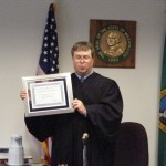 Justice Korsmo accepts his certificate of appreciation